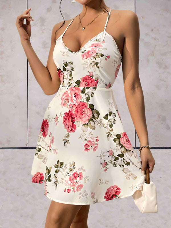 Bella- Hvid kjole med blomstermønster og spaghettistropper