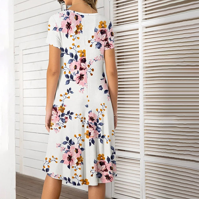 Amara - Forårets opvågnen: Kjole med blomsterprint og lommedekoration