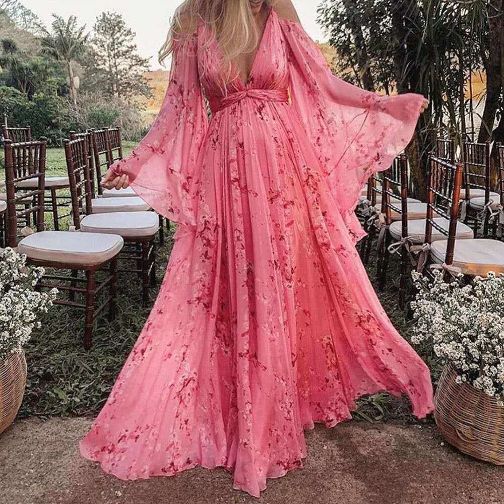 Elara Mode - Pink maxikjole med blomstermønster og sommerfugleærmer