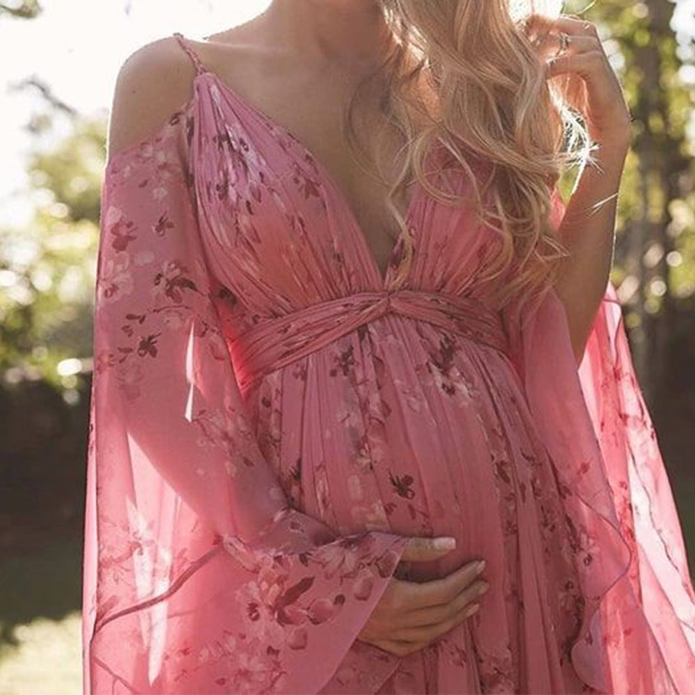 Elara Mode - Pink maxikjole med blomstermønster og sommerfugleærmer