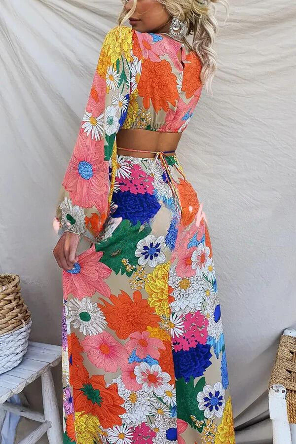 Livia's Farverige kjole med pufærmer og blomsterprint