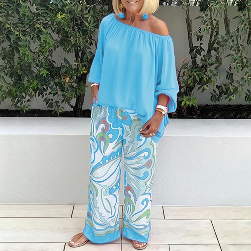 Elara - Stilfuld off-shoulder-bluse med brede bukseben
